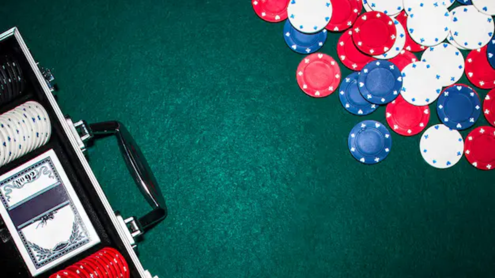 overhead-view-aluminium-suitcase-with-poker-set-poker-table_23-2147881042